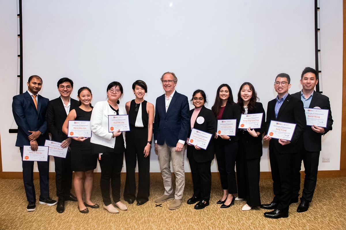 The inaugural cohort of Duke-NUS Health Innovator Programme celebrate the end of their nine-month journey with programme lead, Rena Dharmawan and Duke-NUS Dean Thomas Coffman