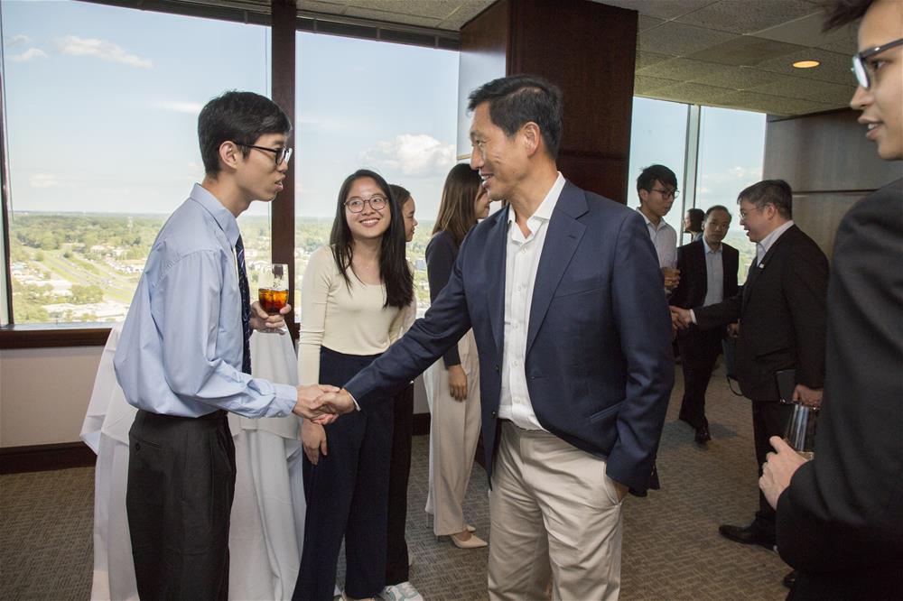 Duke-NUS third-year student Mr Liow Yuh Yiing meets Minister Ong during the reception // Credit: Chris Hildreth/Rooster Media