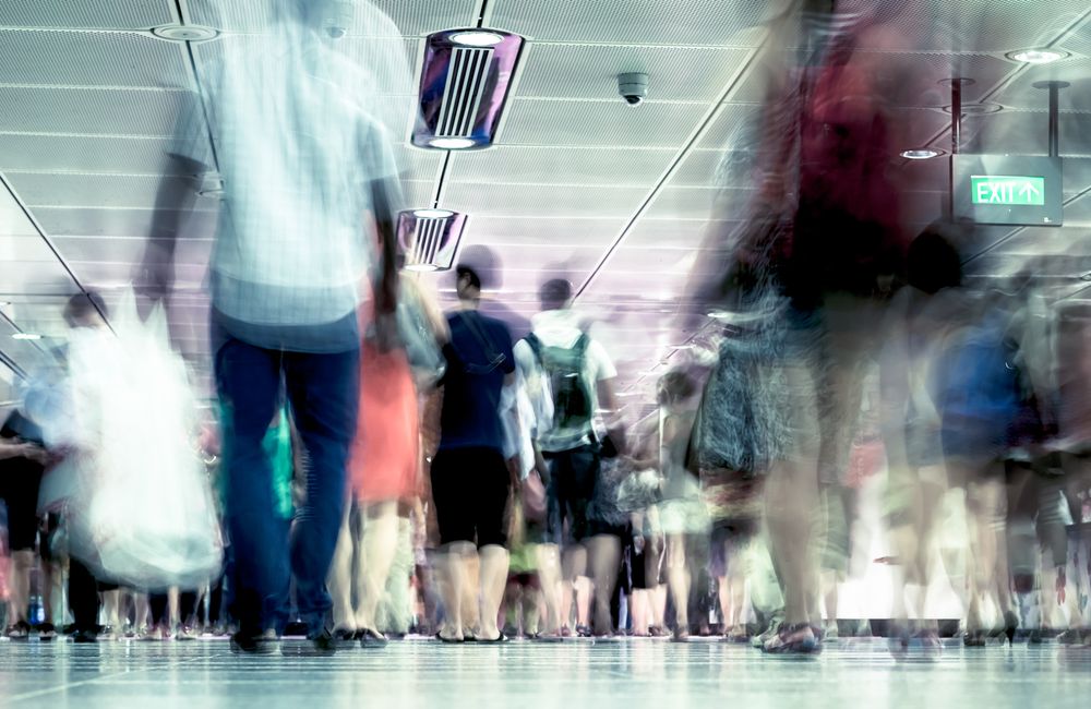 Commuters walking along in an MRT station