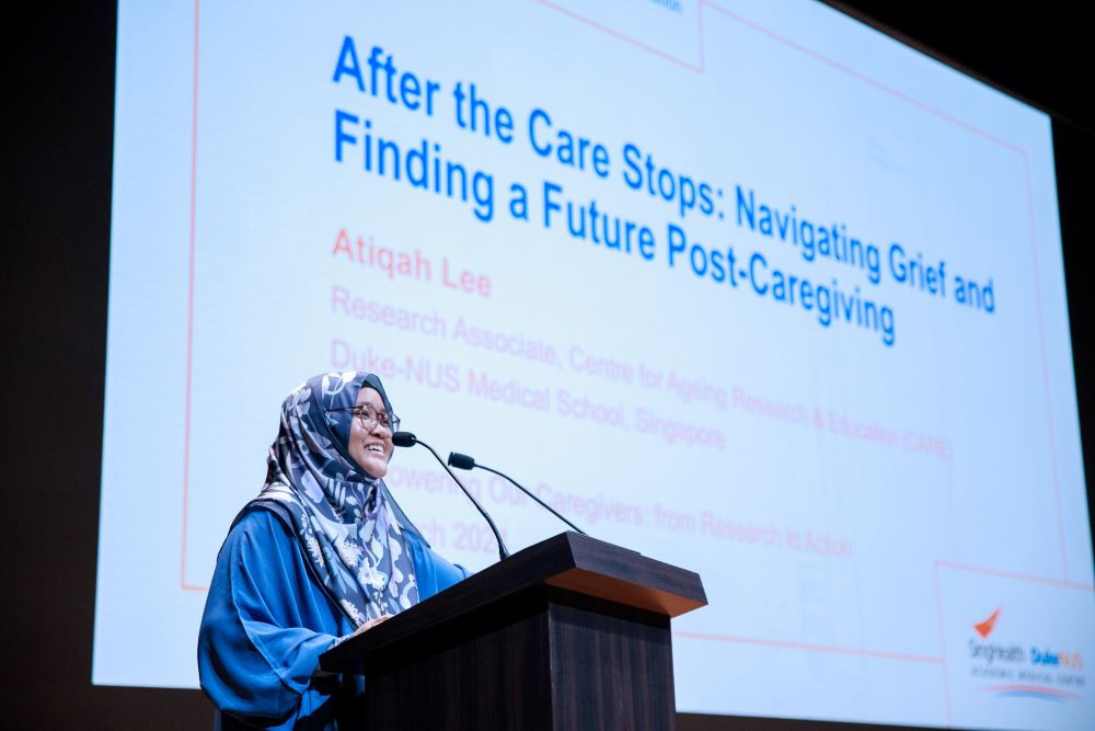 Lee presenting her study on caregivers at the Caregiver Symposium just last year