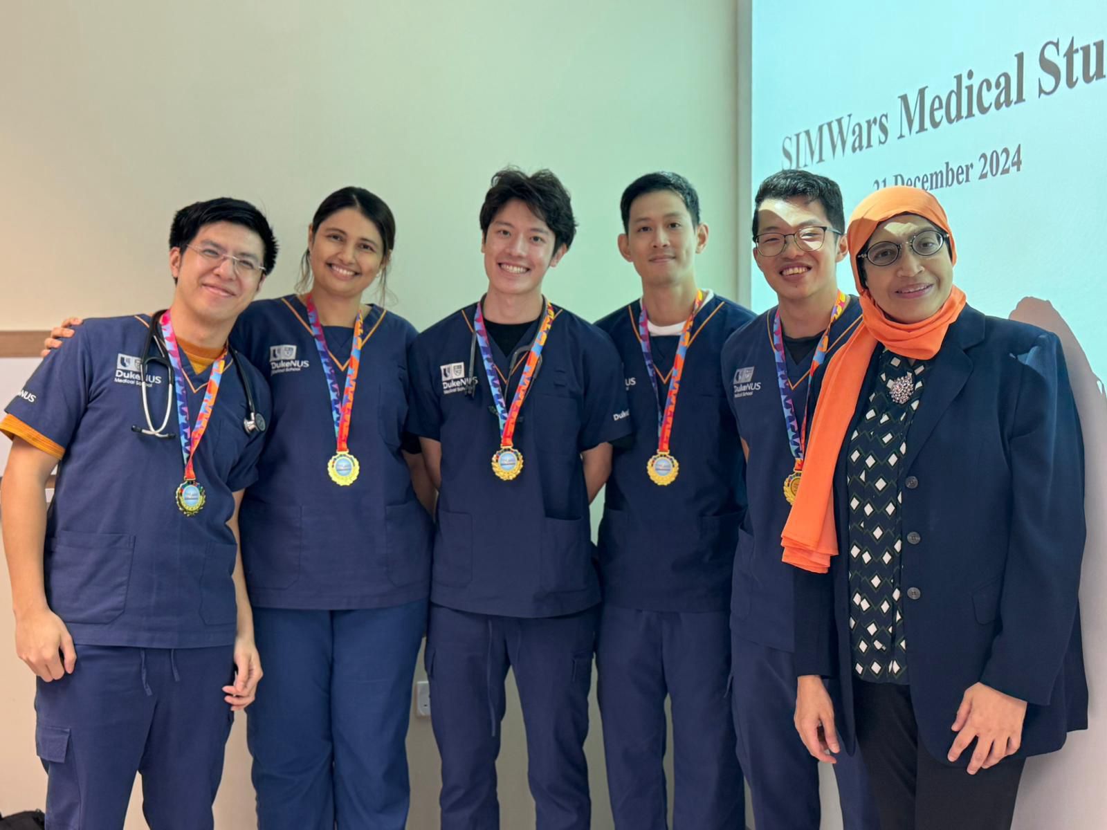 The winning DukeNUS team with Prof Fatimah Binte Abdul Lateef at SIMWars