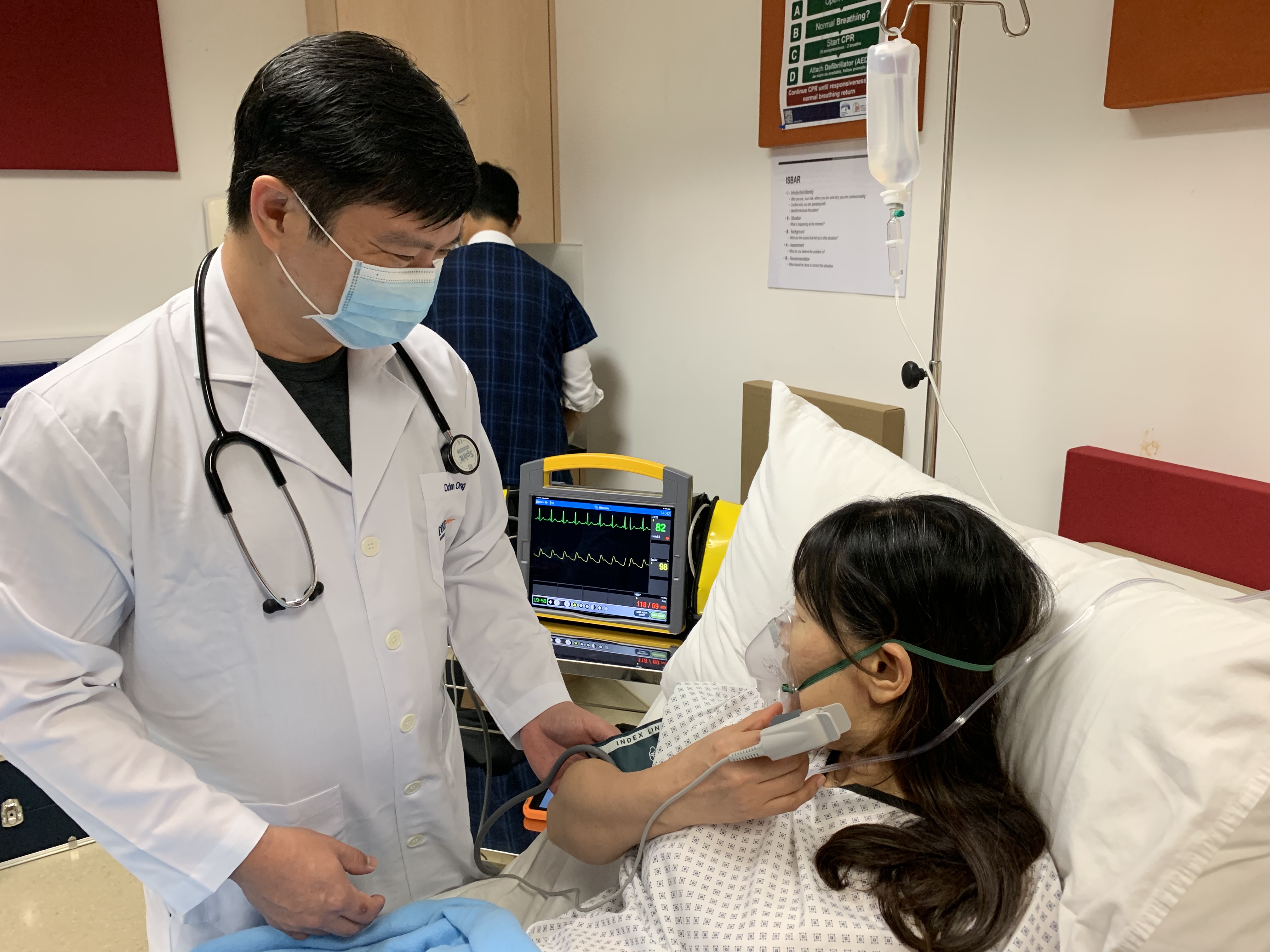 Students practise their examination skills on a manikin and simulated patients