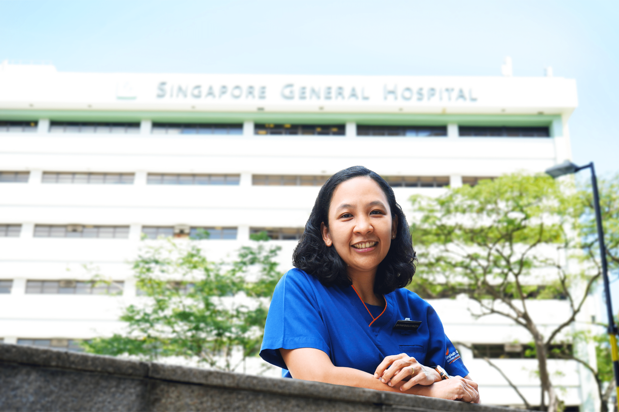 A picture of emergency physician Dr Pamela Basilio-Razon in front of Singapore General Hospital