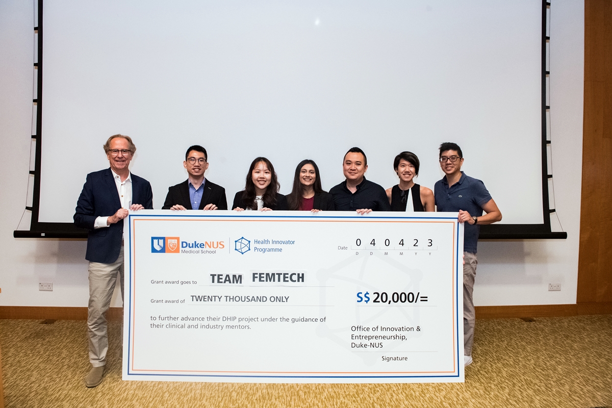The team of students that won the top prize for their invention that helps prevent vaginal tears during childbirth receive a check for S$20,000