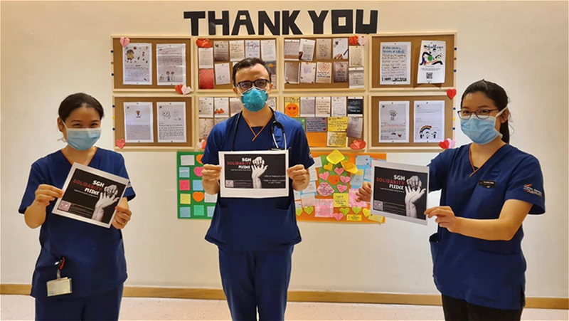 Drs Cheong May Anne, Maverick Uy and Trina Arifin celebrate the success of their project which started with an WhatsApp message // Credit: Than Zaw Oo