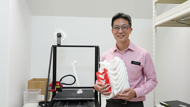Mark Tan from Singapore General Hospital holds a 3D print specimen