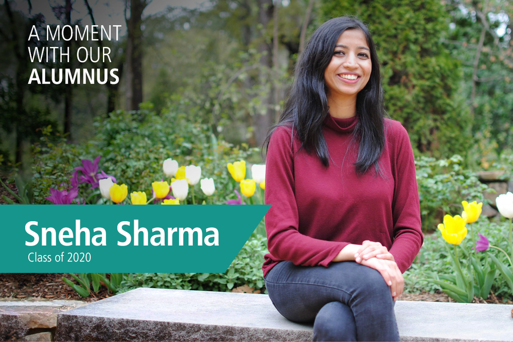 Duke-NUS alumnus Sneha Sharma sitting in Duke Gardens