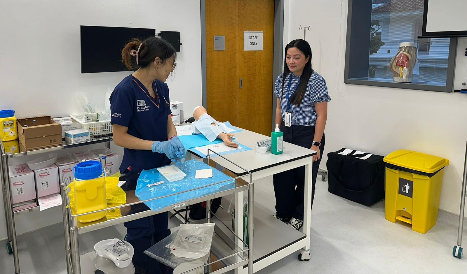 Legaspi-Pelayo observes a Year 2 student inside the Procedural Skills Learning Lab performing an aseptic blood culture collection procedure. Legaspi-Pelayo observes a Year 2 student inside the Procedural Skills Learning Lab performing an aseptic blood culture collection procedure.
