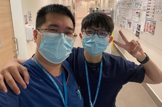 Dr Kwan Yu Heng (left) marks his rotation at Changi General Hospital with a friend