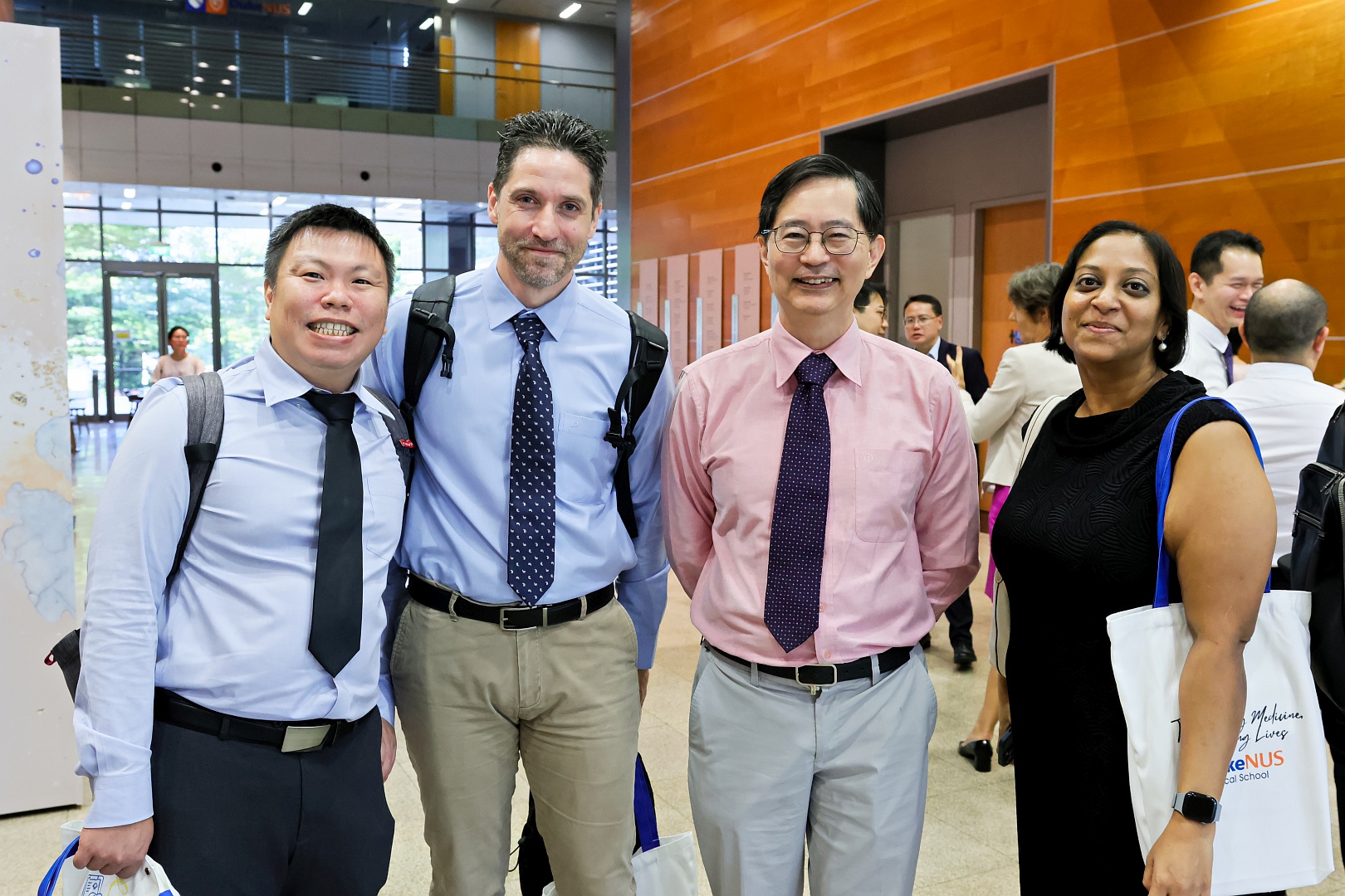 Dean Patrick Tan (third from left) with honourees (from left) Associate Professor Lim Weng Khong, Adjunct Associate Professor Tudor Groza, and Clinical Associate Professor Kaavya Narasimhalu