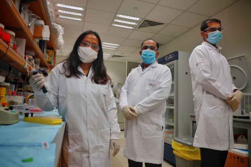 Duke-NUS Medical School's senior research associate Kalpana Ramnarayanan and research fellow Vikrant Kumar, and National University Cancer Institute consultant Raghav Sundar