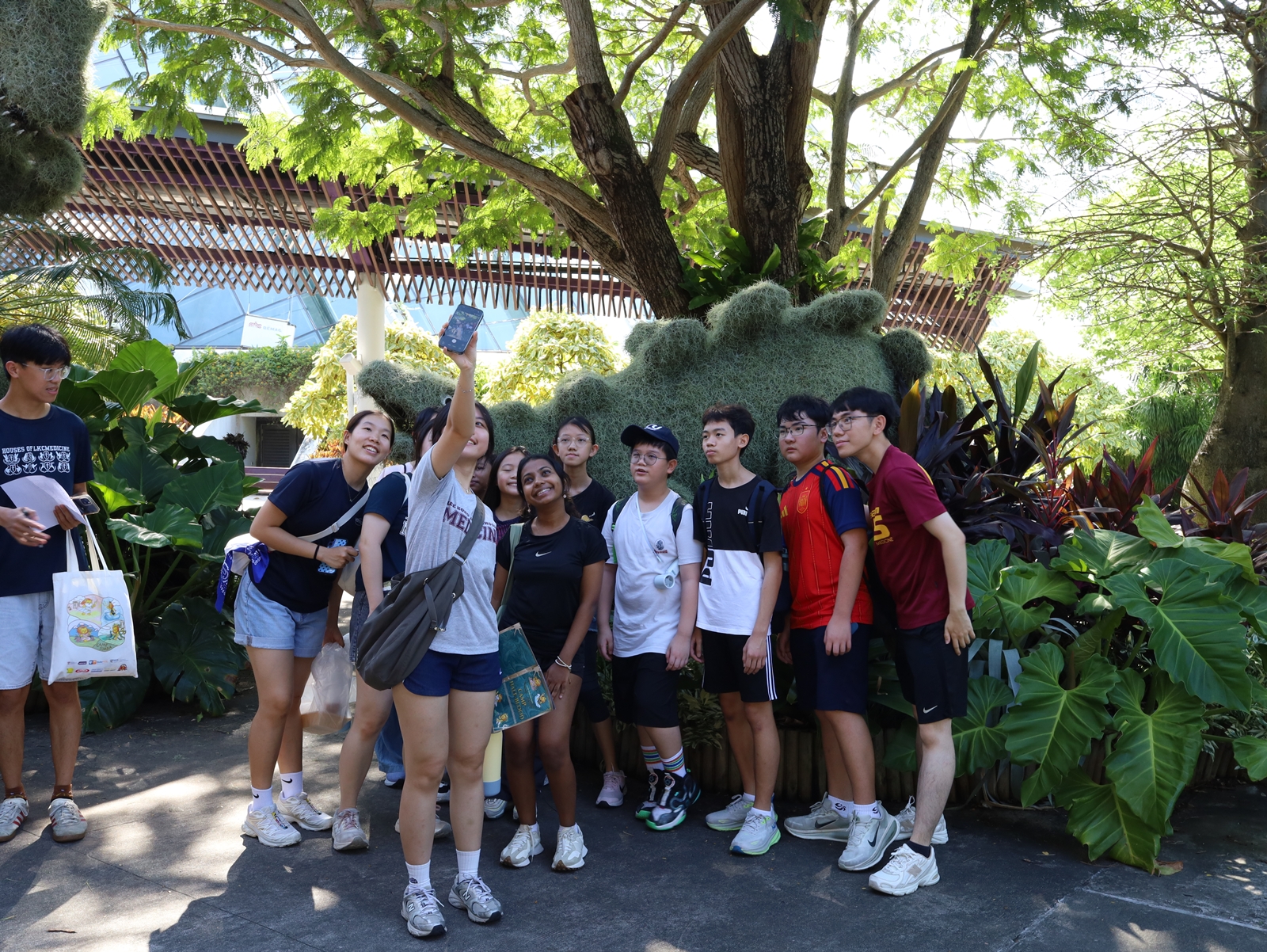 Campers and student facilitators pose for a wefie during an excursion to Gardens by the Bay.