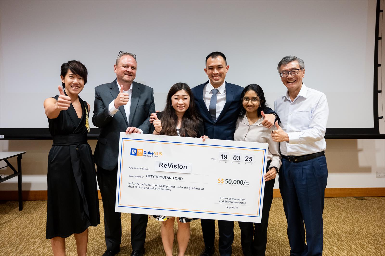 Team ReVision with Guest-of-Honour NUS President Prof Tan Eng Chye, Asst Prof Rena Dharnawan and Assoc Prof Chris Laing