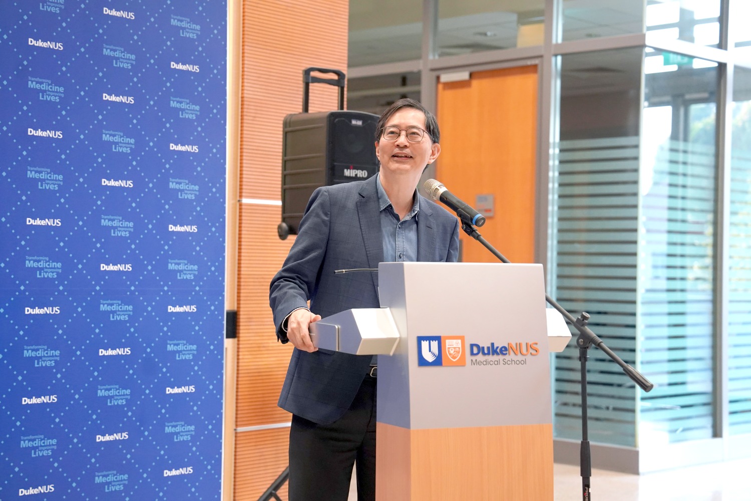 Dean Professor Patrick Tan makes his welcome remarks at the OIE Impact Review launch