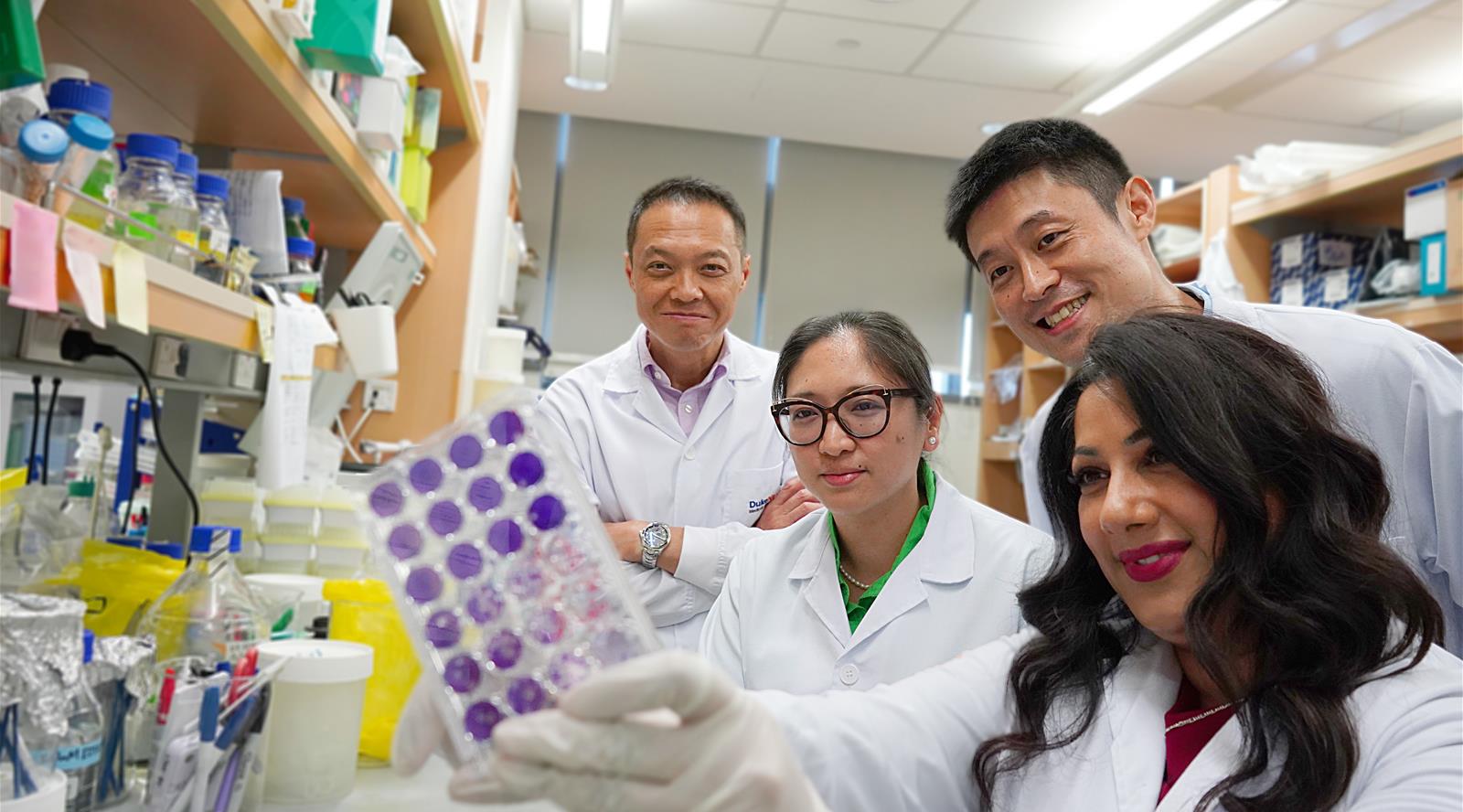 From right, Assistant Professor Ann-Marie Chacko, Assistant Professor Alfred Sun, Dr Carla Bianca Luena Victorio and Professor Ooi Eng Eong with a culture of their Zika vaccine strains.
