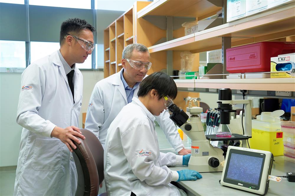 From left: Clinical Assoc Prof Frederick Koh, Prof Wang Yibin and (in foreground) Dr Hong Jing Han, part of the MAGNET team incorporating cutting-edge AI, genomic and molecular technologies.