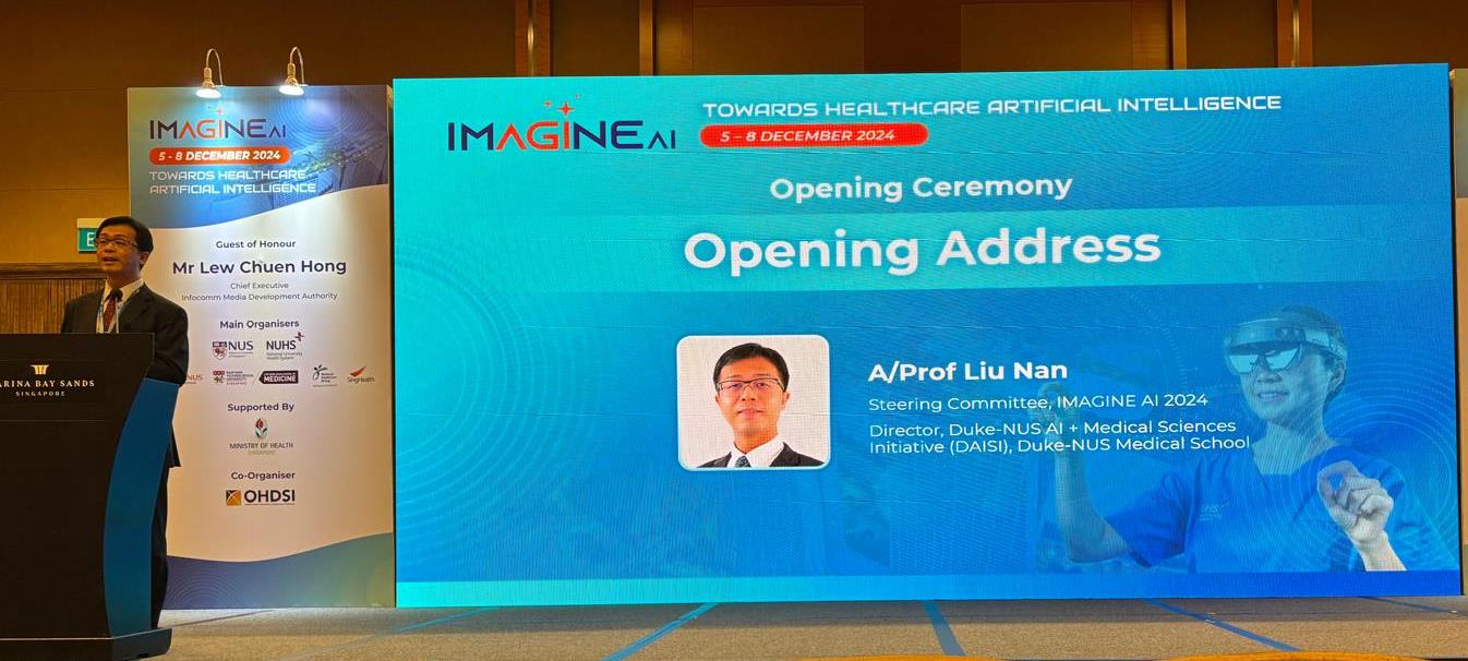 A man standing at a podium addressing the audience at a conference