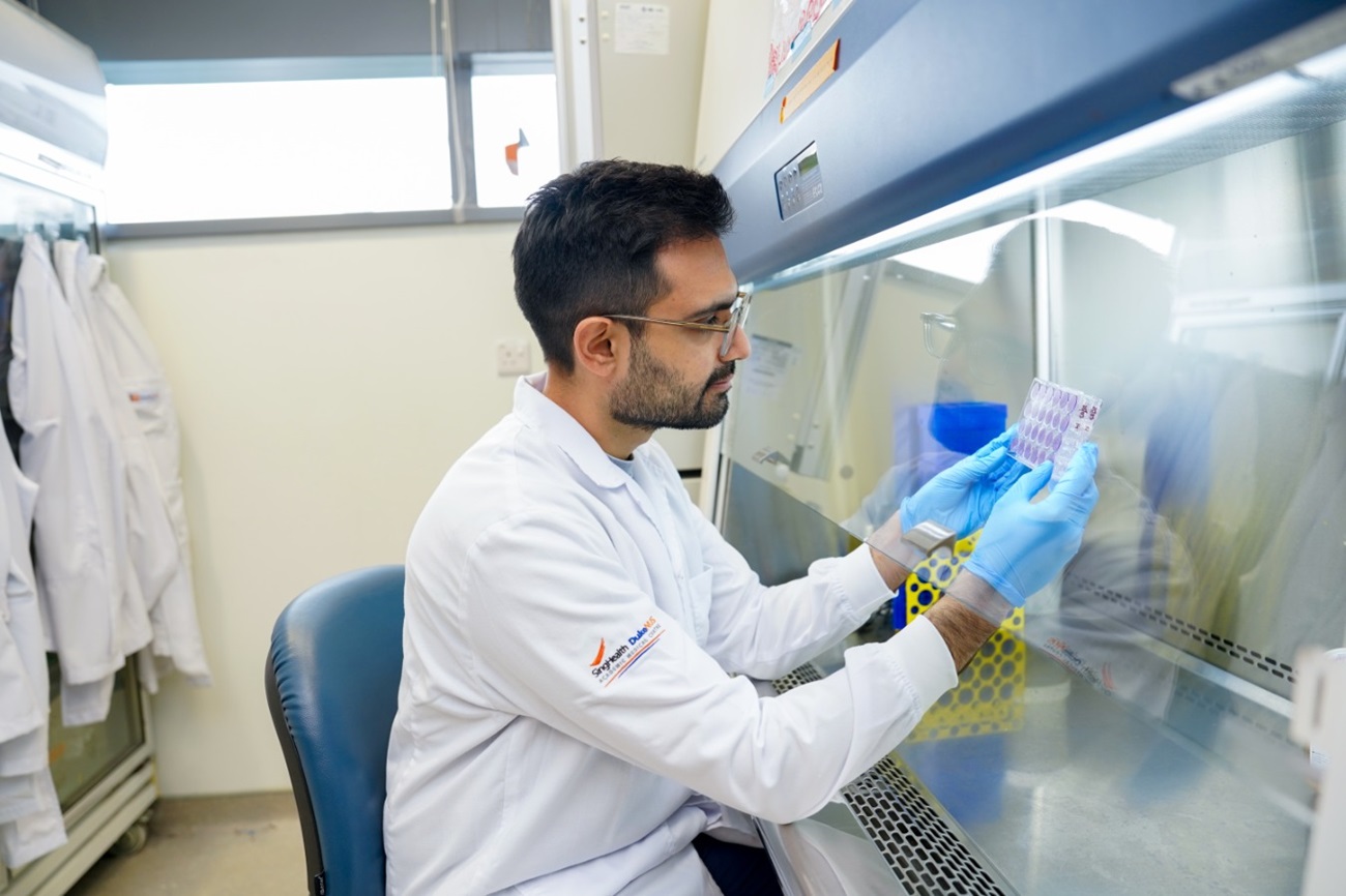 Study team researcher reviewing patient immune test results. Study team researcher reviewing patient immune test results.