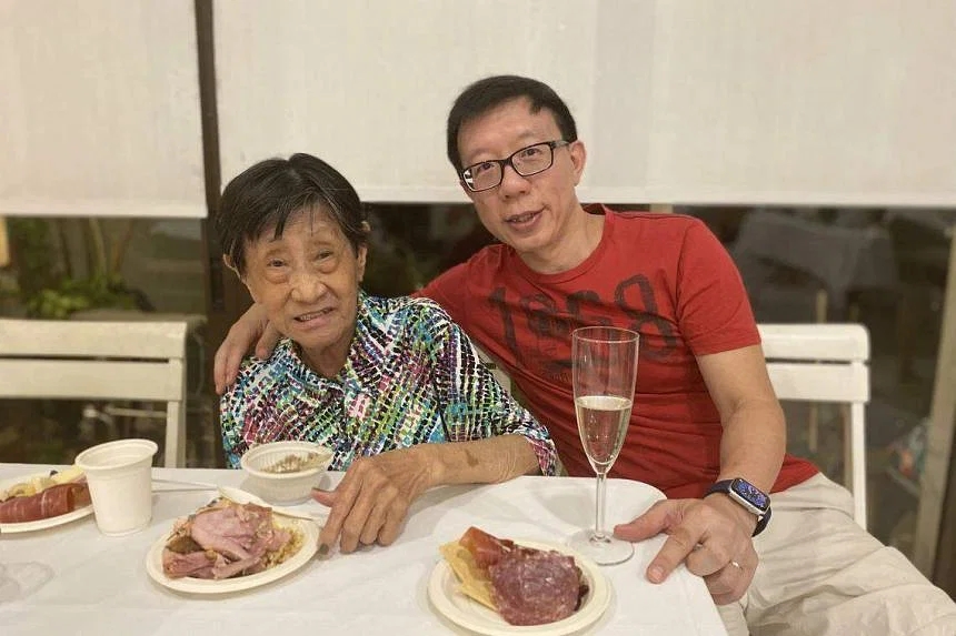Prof Tan with his mother-in-law, Madam Chor Poh Giok, in a photo taken in Christmas 2022