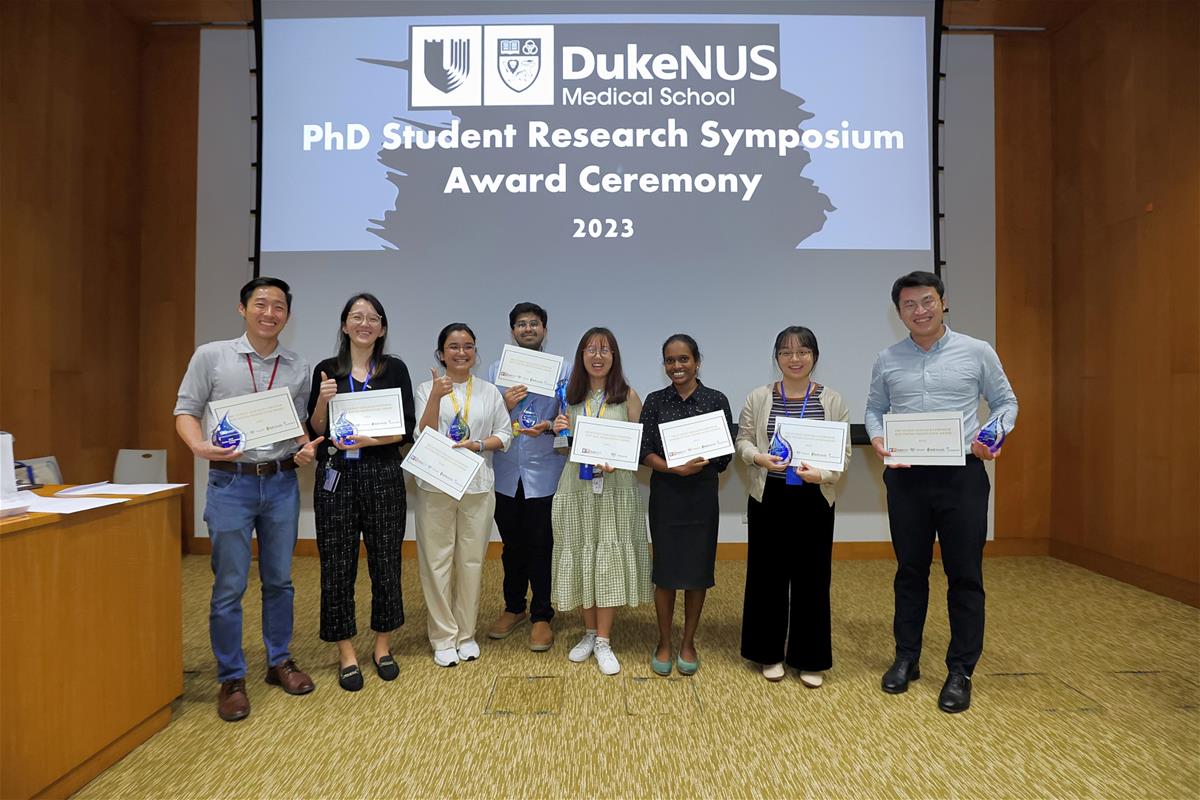 All smiles as the winners of the Best Oral Presentation and Best Poster Award pose for a group photo together