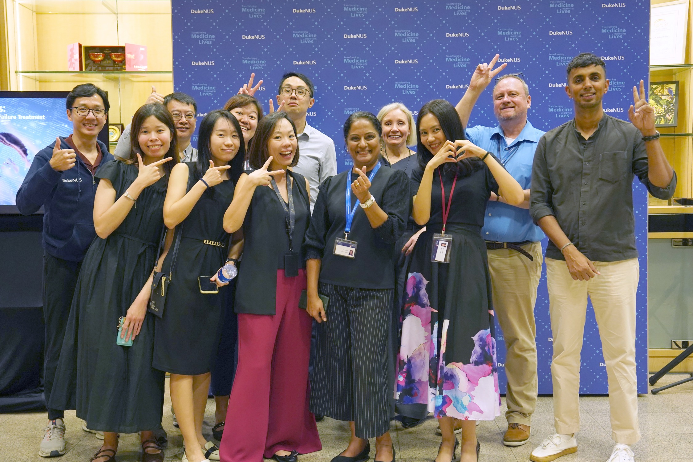 Team OIE poses for the launch of OIE Impact Review