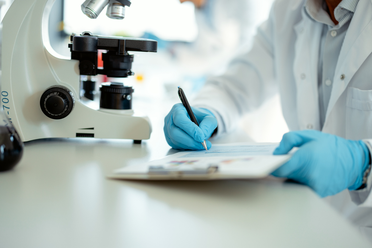 Medical Scientist Analyzing Data in Clinical Lab