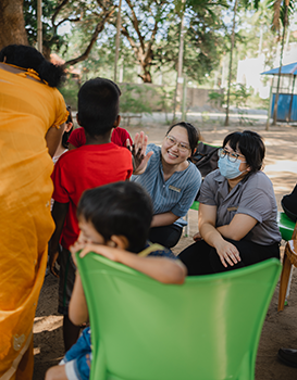 Duke-NUS medical students and faculty taking part in a community-oriented primary