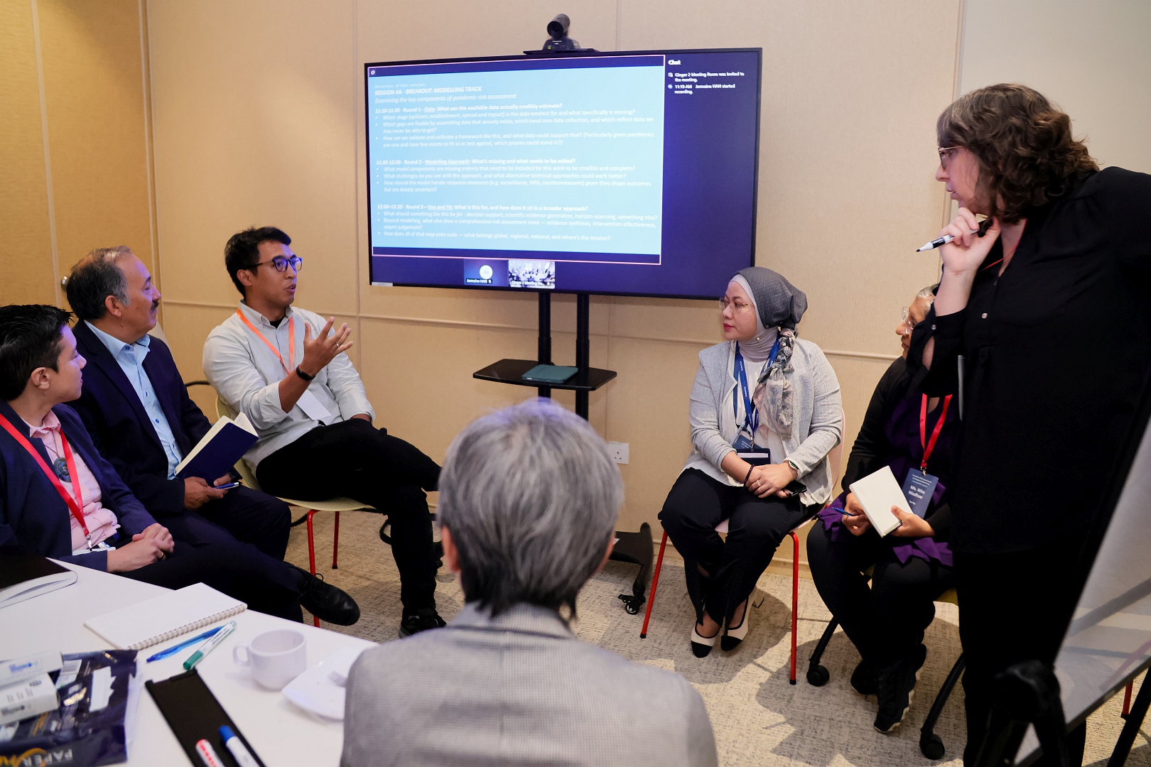 Participants in the technical breakout group engage in discussion