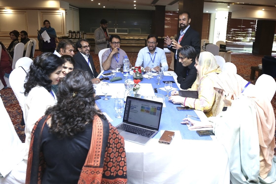 Workshop participants gathered around a table