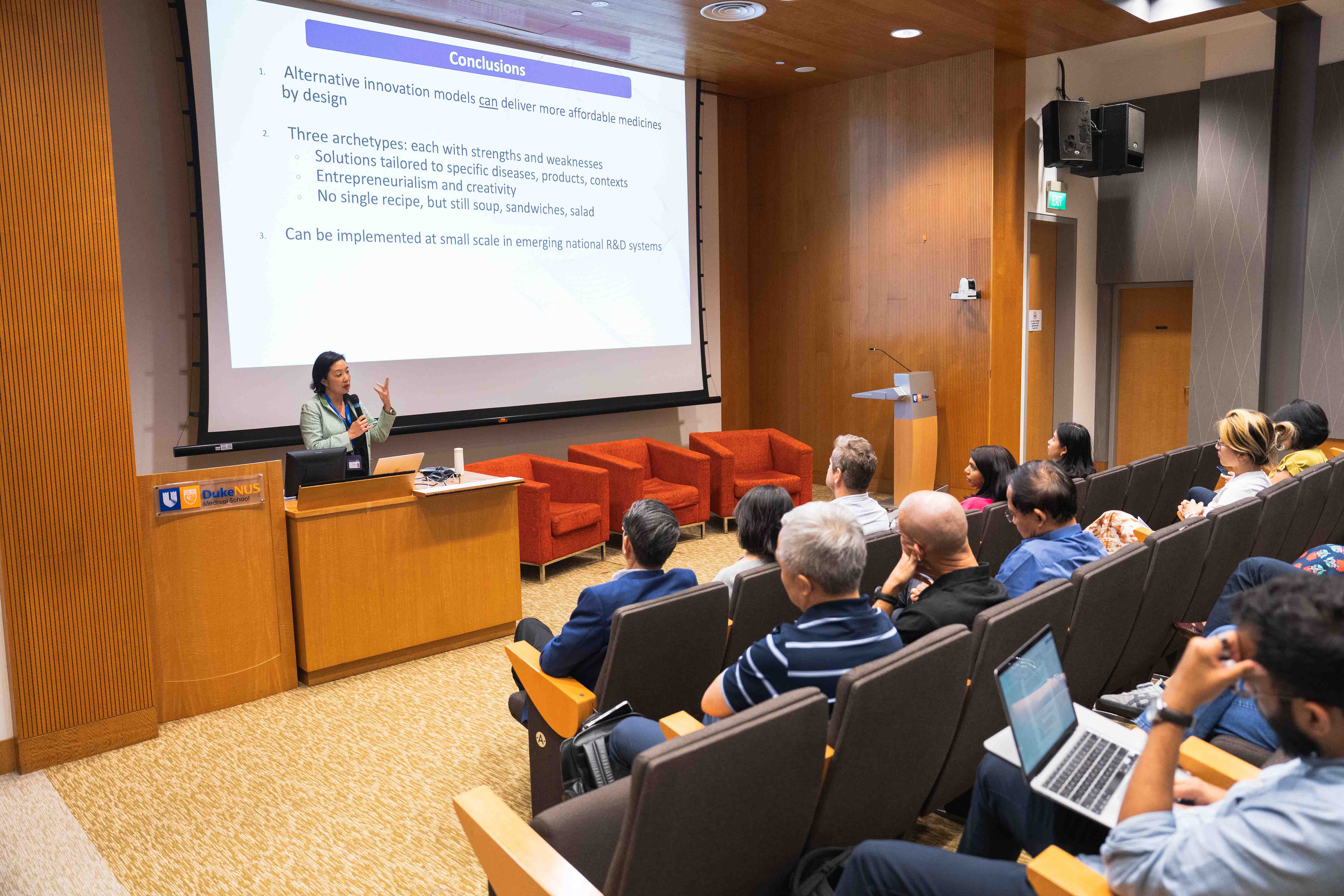 Prof Suerie Moon giving a talk