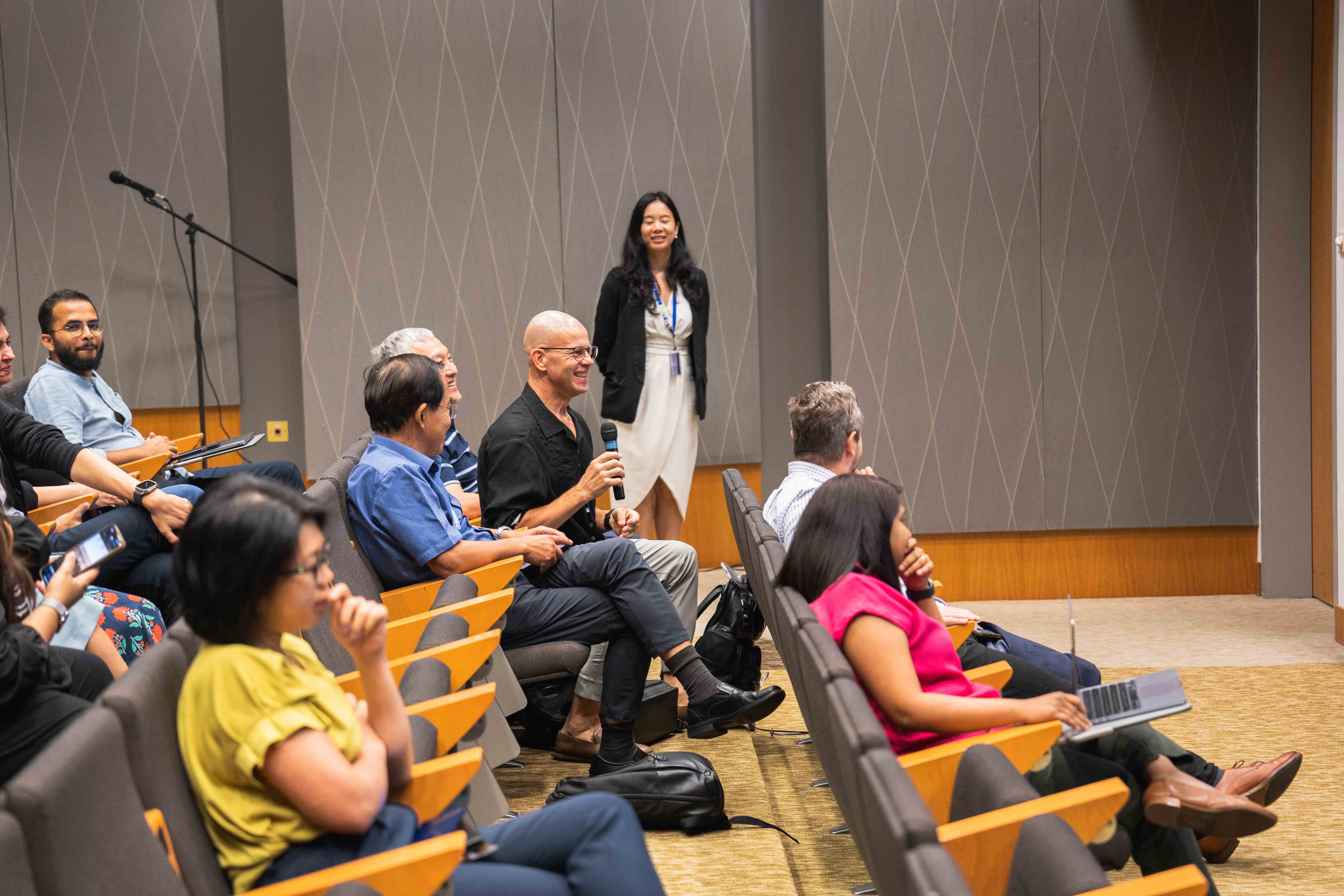 Audience members asking questions